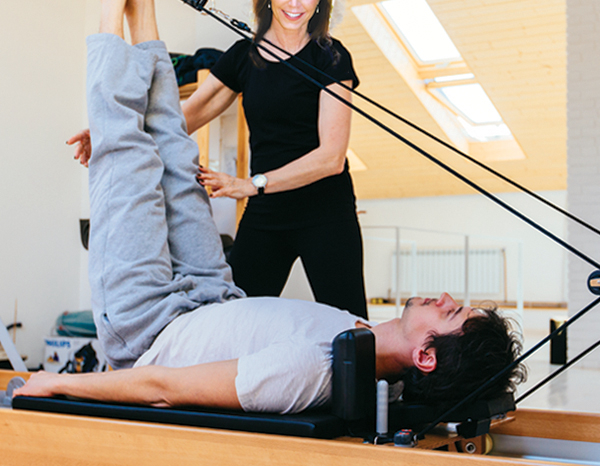 pilates-pain-relief-and-rehab-man-on-reformer